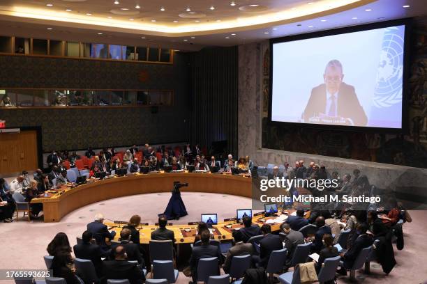 Members of the Security Council listen as Commissioner-General of the UN Relief and Works Agency for Palestine Refugees Philippe Lazzarini speaks...