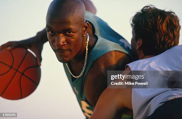 Basketball, player with ball being blocked by opponent, close-up