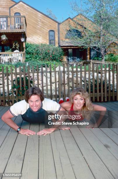 Married American couple, Olympic athlete Bruce Jenner and model & actress Linda Thompson Jenner do push-ups as they exercise together, Los Angeles,...