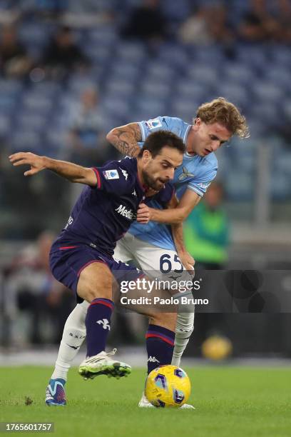 Nicolo Rovella of SS Lazio competes for the ball with Giacomo Bonaventura of ACF Fiorentina during the Serie A TIM match between SS Lazio and ACF...