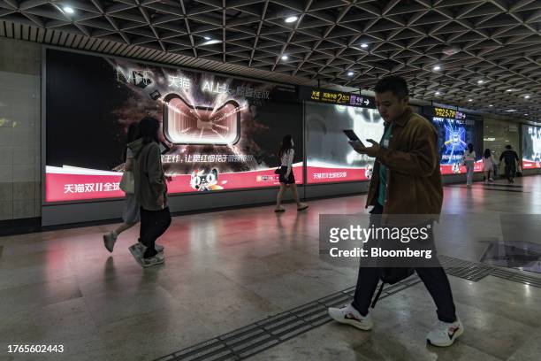 An advertisement for the Singles' Day shopping event on Alibaba Group Holding Ltd.'s Tmall e-commerce platform at a subway station in Shanghai,...