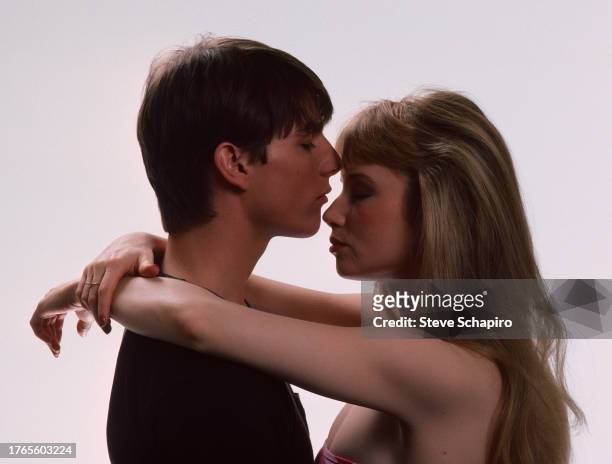 Publicity portrait of American actors Tom Cruise and Rebecca DeMornay as they embrace, against a white background, for the film 'Risky Business' ,...
