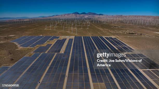Wind and solar panels merge in desert alternative energy site in Mojave, CA. .
