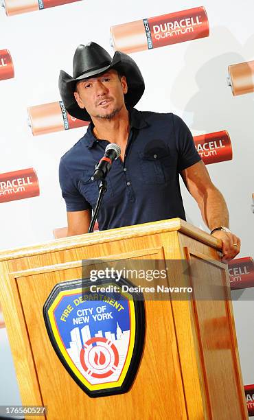 Singer Tim McGraw speaks at the "Quantum Heroes" premiere at Engine 33, Ladder 9 on August 15, 2013 in New York City.