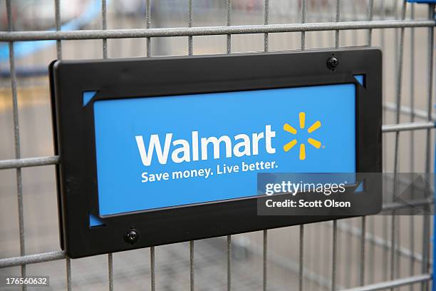 The Walmart logo is displayed on a shopping cart at a Walmart store on August 15, 2013 in Chicago, Illinois. Walmart, the world's largest retailer,...