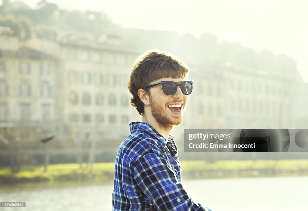 Young man, sunglasses, smiling