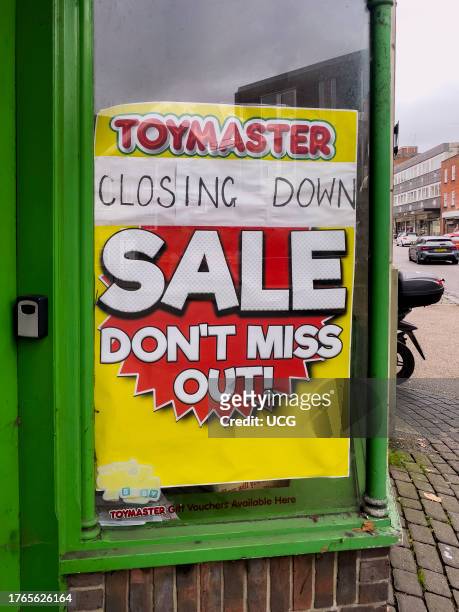 Closing down sale sign on a toy shop window in the city center of Winchester, UK.