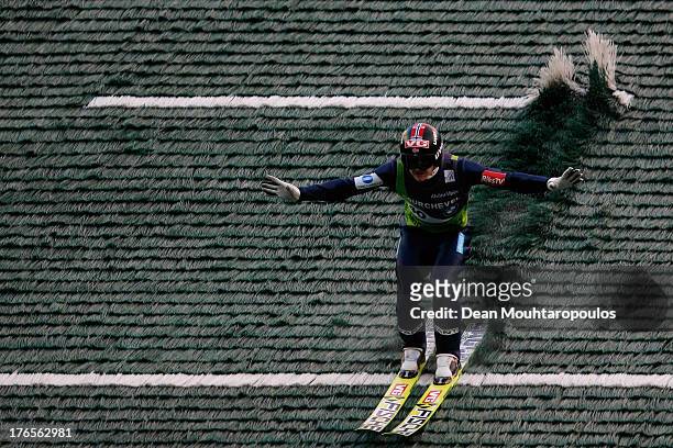 Tom Hilde of Norway competes in the FIS Ski Jumping Grand Prix Mens Large Hill Individual Final on August 15, 2013 in Courchevel, France.