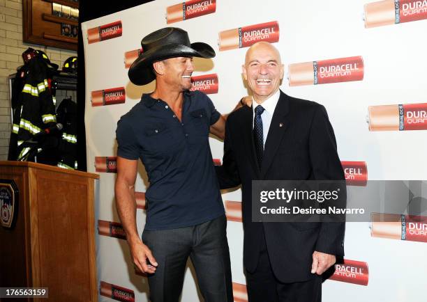 Singer Tim McGraw and New York City Fire Commissioner Salvatore J. Cassano attend the "Quantum Heroes" premiere at Engine 33, Ladder 9 on August 15,...