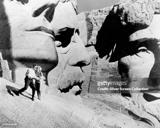Roger O. Thornhill, played by Cary Grant , and Eve Kendall, played by Eva Marie Saint, make their escape onto Mount Rushmore in 'North by Northwest',...