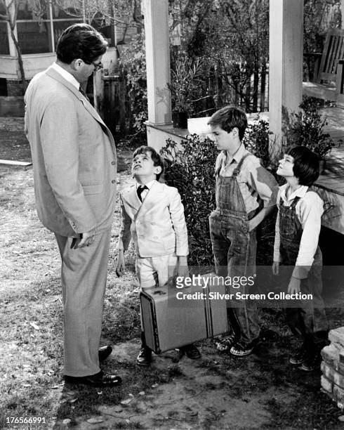American actors Gregory Peck as Atticus Finch, John Megna as Charles Baker 'Dill' Harris, Phillip Alford as Jem Finch, and Mary Badham as Scout Finch...