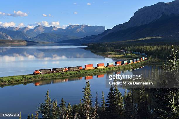 intermodal train curving by brule lake - boxcar stock pictures, royalty-free photos & images