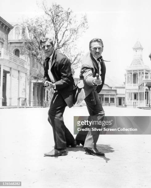 American actors Burt Lancaster , as Wyatt Earp, and Kirk Douglas as Doc Holliday, in a publicity still for 'Gunfight At The O.K. Corral', directed by...