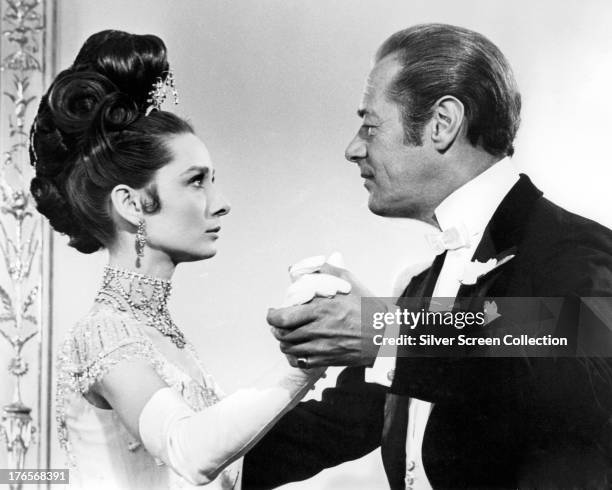 Audrey Hepburn , as Eliza Doolittle, and Rex Harrison as Professor Henry Higgins in 'My Fair Lady', directed by George Cukor, 1964.