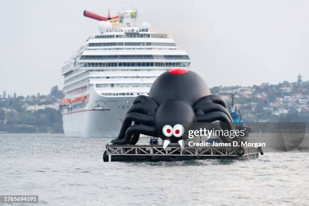 Giant spider sits on a barge floating on Sydney Harbour as Carnival Splendor arrives on October 31, 2023 in Sydney, Australia. Carnival Cruise Line's...