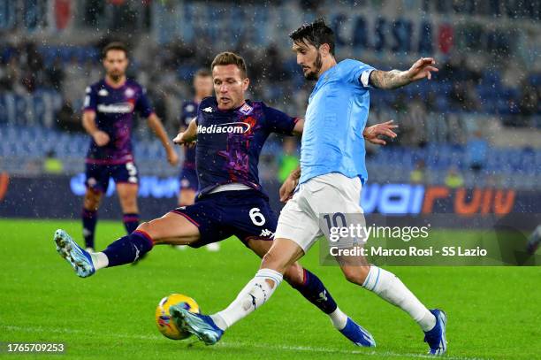 Luis Alberto of SS Lazio compete for the ball with Arthur of ACF Fiorenitina during the Serie A TIM match between SS Lazio and ACF Fiorentina at...