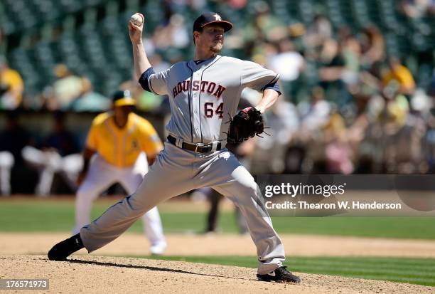 Lucas Harrell of the Houston Astros pitches in the fifth inning against the Oakland Athletics at O.co Coliseum on August 15, 2013 in Oakland,...