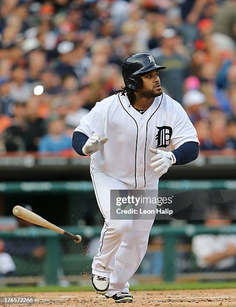 Prince Fielder of the Detroit Tigers hits a two run home run in the first inning scoring Andy Dirks during the first inning of the game against the...