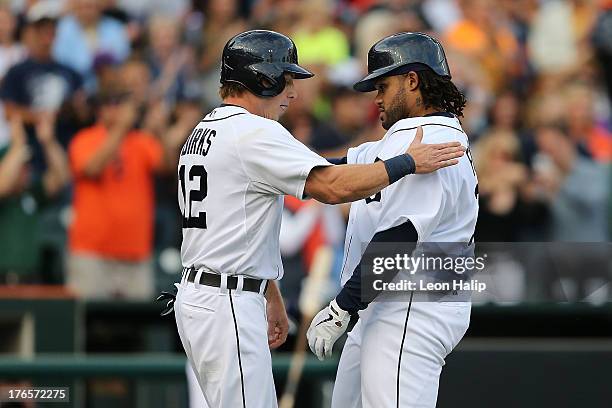 Prince Fielder of the Detroit Tigers is congratulated by teammate Andy Dirks after hitting a two run home run in the first inning of the game against...