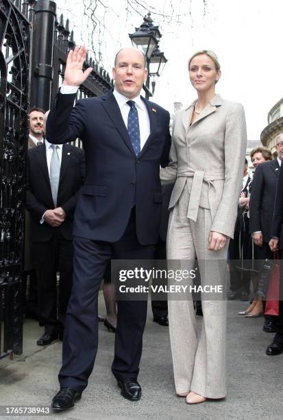 Prince Albert II of Monaco and his girlfriend South African swimmer Charlene Wittstock pose in a street of Dublin, on April 4 during a state visit in...