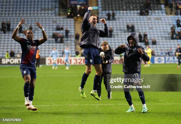 Brandon Thomas-Asante, Jed Wallace and Grady Diangana of West Bromwich Albion celebrate victory following the Sky Bet Championship match between...