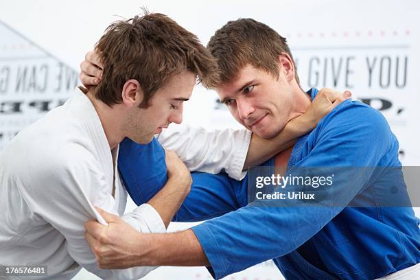 equally focused on the fight - jujitsu stock pictures, royalty-free photos & images