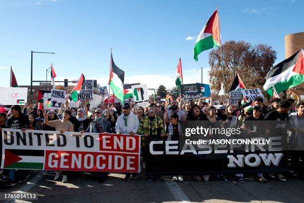 Demonstrators march down Colfax Avenue during a rally in support of Palestinians in Denver, Colorado, on November 5, 2023. Thousands of people, both...