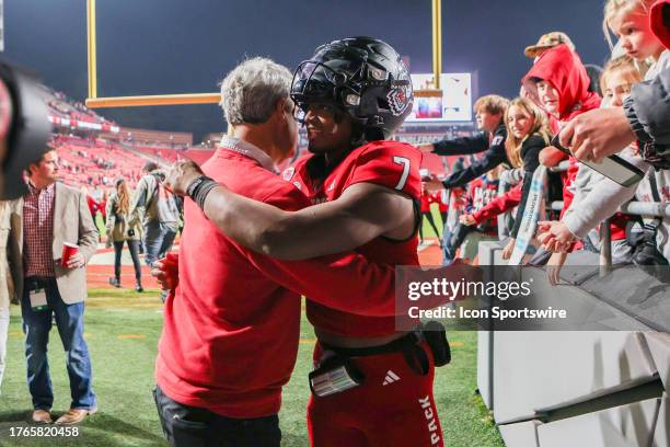 North Carolina State Wolfpack quarterback MJ Morris hugs North Carolina State athletic director Boo Corrigan after the college football game between...