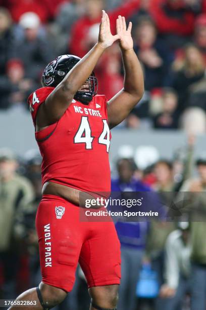 North Carolina State Wolfpack defensive lineman Brandon Cleveland holds up the U before breaking it over his leg during the college football game...