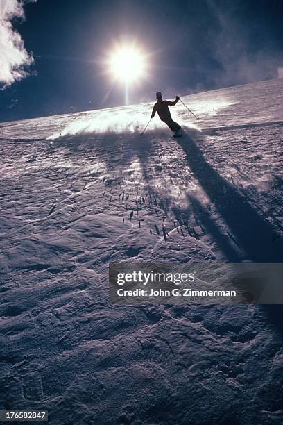 Silhouette view of skiier in action on Briar Rose Mountain. Summit County, CO 3/14/1972 CREDIT: John G. Zimmerman