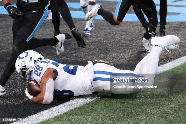 Indianapolis Colts running back Jonathan Taylor falls across the goal line to score a touch down during a NFL football game between the Indianapolis...