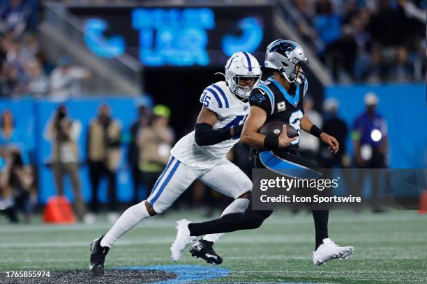 Carolina Panthers quarterback Bryce Young runs up field as he is chased by Indianapolis Colts linebacker E.J. Speed during a NFL game between the...