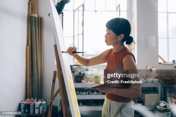 modern art unveiled by a female creative - canvas stand stock pictures, royalty-free photos & images
