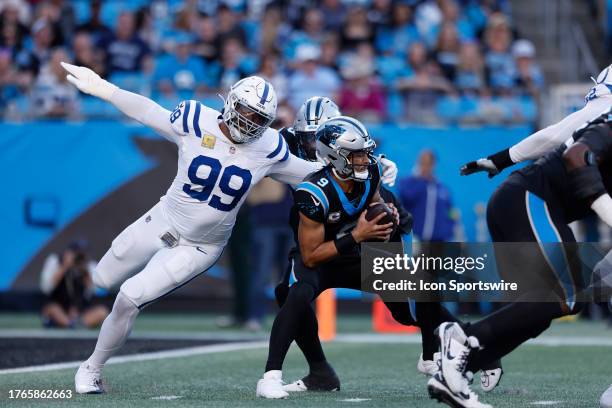 Indianapolis Colts defensive tackle DeForest Buckner puts pressure on Carolina Panthers quarterback Bryce Young during a NFL game between the...