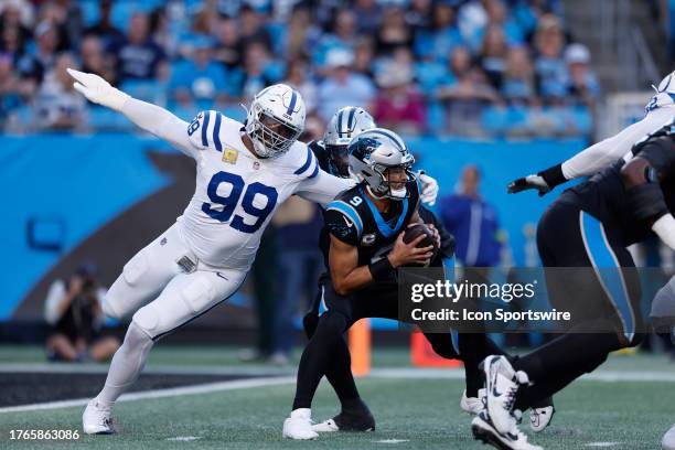 Indianapolis Colts defensive tackle DeForest Buckner puts pressure on Carolina Panthers quarterback Bryce Young during a NFL game between the...