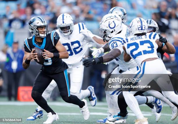 Carolina Panthers quarterback Bryce Young backs up as he is under pressure Indianapolis Colts defensive tackle Eric Johnson II , Indianapolis Colts...