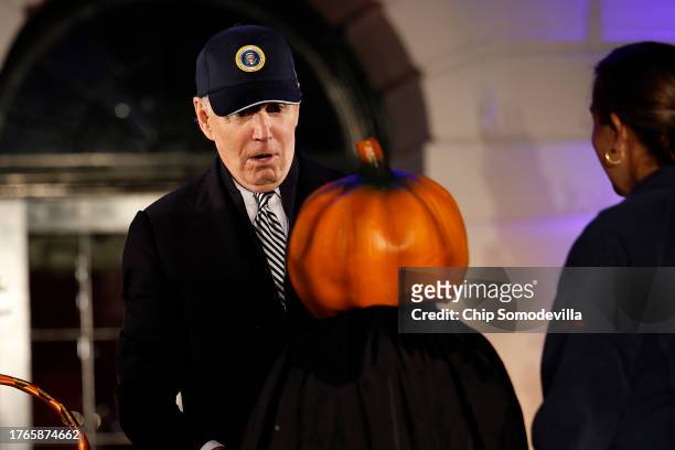 President Joe Biden reacts to a child's Halloween costume during a trick-or-treat event on the South Lawn of the White House on October 30, 2023 in...