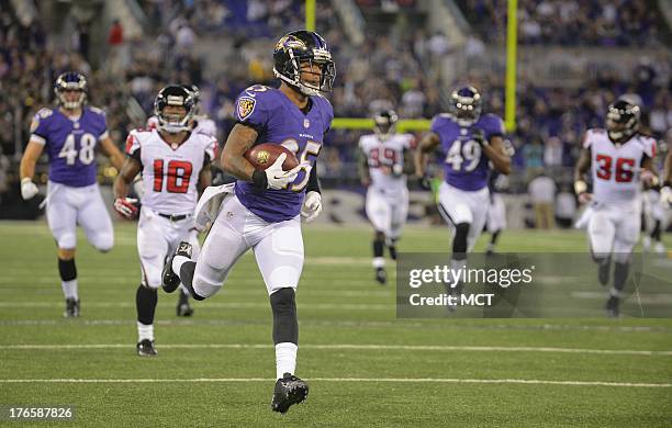 Baltimore Ravens cornerback Asa Jackson scores a touchdown on a 78 yard return against the Atlanta Falcons during the second half of their game at...