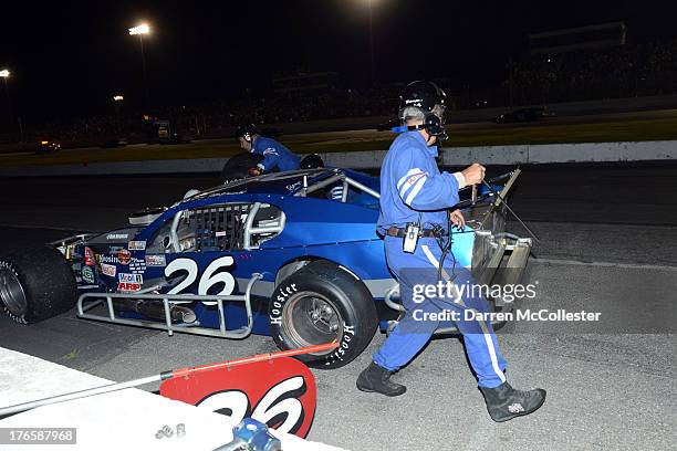 Pit crews go to work on Gary McDonald Lakeland Landscape/TRC Electric Pontiac during the Budweiser King of Beers 150 at Thompson Speedway August 15,...