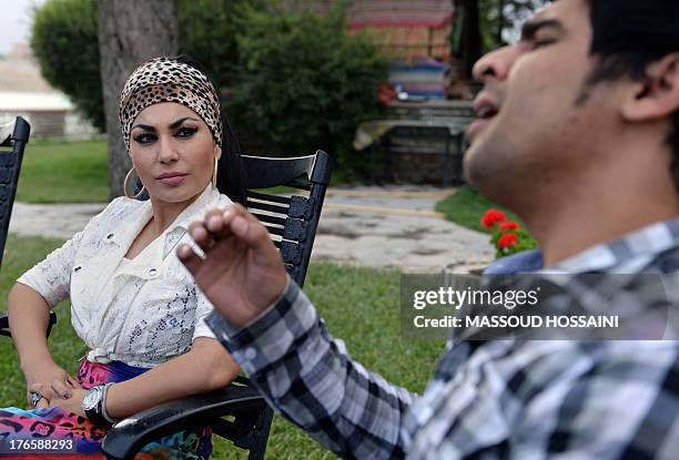 Afghanistan-unrest-women-culture,FEATURE by Edouard GUIHAIRE In this photograph taken on July 12 Afghan female singer Aryana Sayeed listens to a...