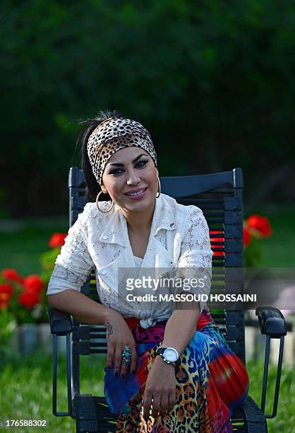 Afghanistan-unrest-women-culture,FEATURE by Edouard GUIHAIRE In this photograph taken on July 12 Afghan female singer Aryana Sayeed listens to...