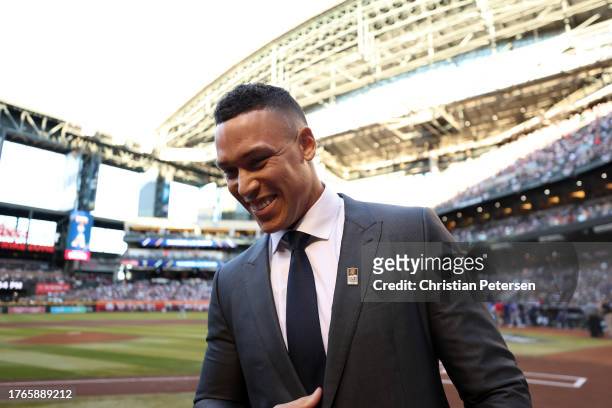 Aaron Judge of the New York Yankees celebrates after being announced as the winner of the 2023 Roberto Clemente Award before Game Three of the World...