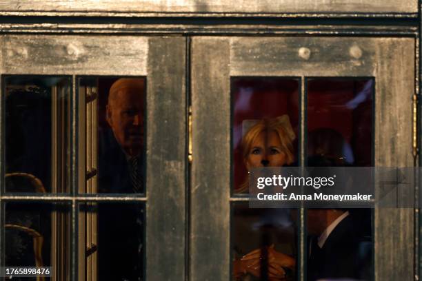 President Joe Biden and First Lady Jill Biden wait to greet trick-or-treaters during a Halloween event on the South Lawn of the White House on...