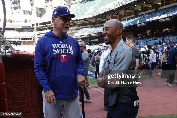 Manager Bruce Bochy of the Texas Rangers and Mookie Betts of the Los Angeles Dodgers meet before Game Three of the World Series against the Arizona...