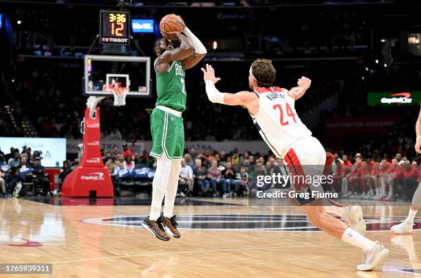 Jaylen Brown of the Boston Celtics shoots the ball in the second quarter against Corey Kispert of the Washington Wizards at Capital One Arena on...