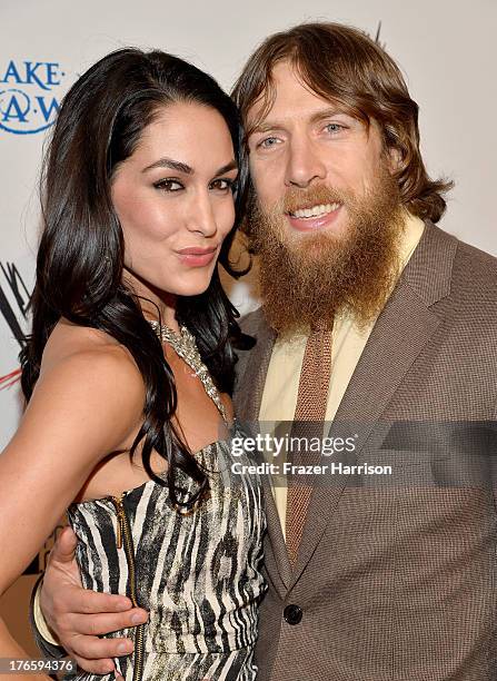 Diva Brie Bella and wrestler Daniel Bryan attend WWE & E! Entertainment's "SuperStars For Hope" at the Beverly Hills Hotel on August 15, 2013 in...