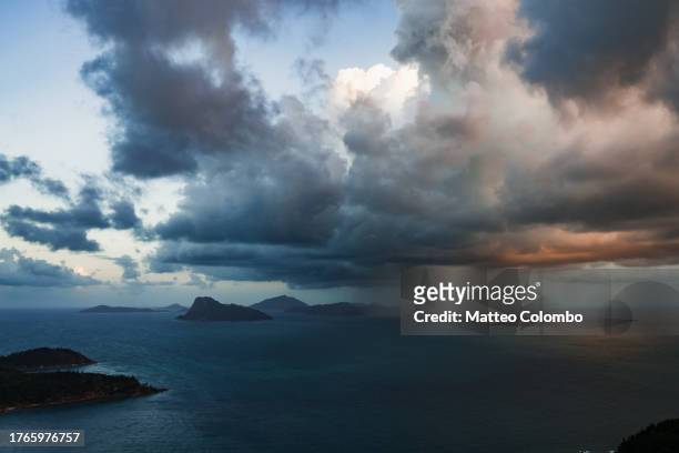 dramatic sunset on the ocean, whitsundays - australia storm stock pictures, royalty-free photos & images