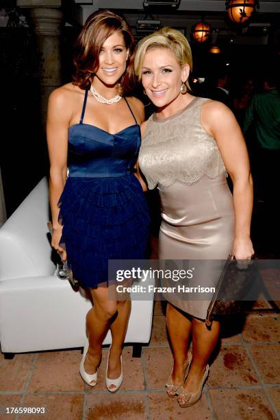 Divas Eve Torres and Natalya attend WWE & E! Entertainment's "SuperStars For Hope" at the Beverly Hills Hotel on August 15, 2013 in Beverly Hills,...