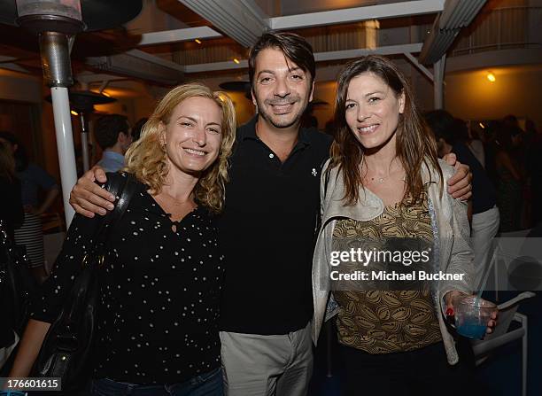 Director Zoe Cassavetes, Joey Jalleo and guest attend Warby Parker's store opening in The Standard, Hollywood on August 15, 2013 in Los Angeles,...