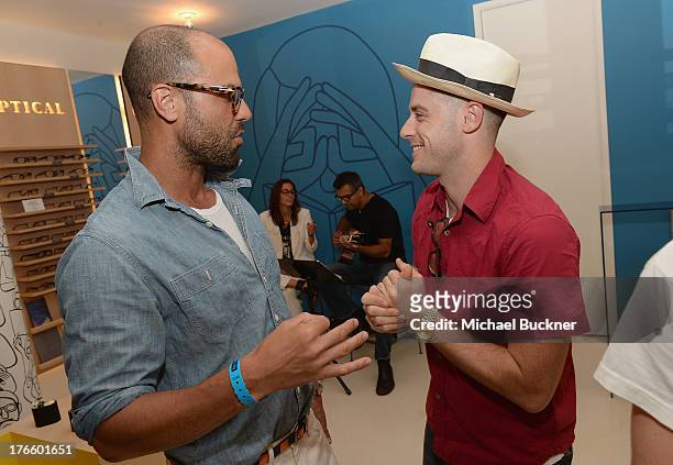 Actors Christian George and Jonny Abrahams attend Warby Parker's store opening in The Standard, Hollywood on August 15, 2013 in Los Angeles,...